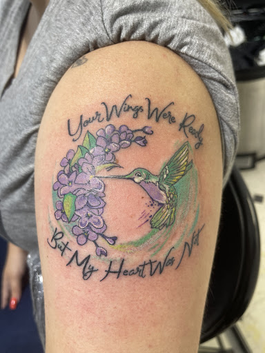 Explore last name tattoo ideas on arm, creative tattoo ideas in Orange, available at Smokin Irons Tattoo