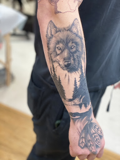 Explore lotus flower tattoo ideas, creative tattoo ideas in Fargo, available at The Inked Huntress Tattoo Studio