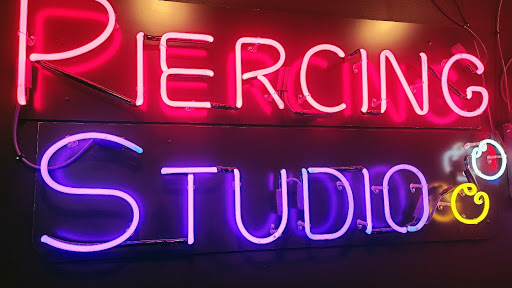 Find tattoo ideas between breast for your next unique tattoo in Saginaw at Hourglass Piercing Studio