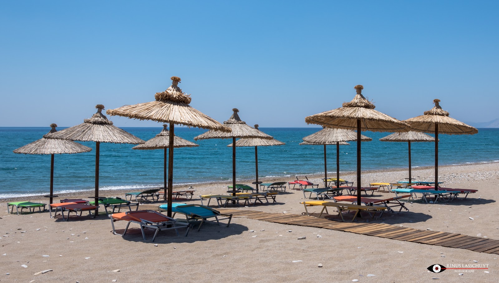 Photo of Votsalakia beach and the settlement