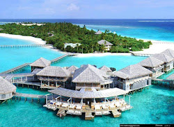 Foto von Six Senses Laamu Strand mit geräumige küstenlinie