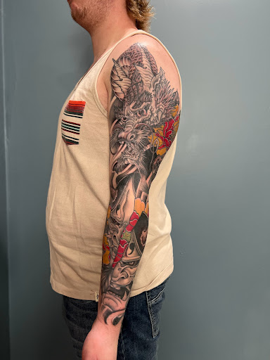 Explore mountaineering tattoo ideas, creative tattoo ideas in Kingsford, available at Deft Tattoo Studio