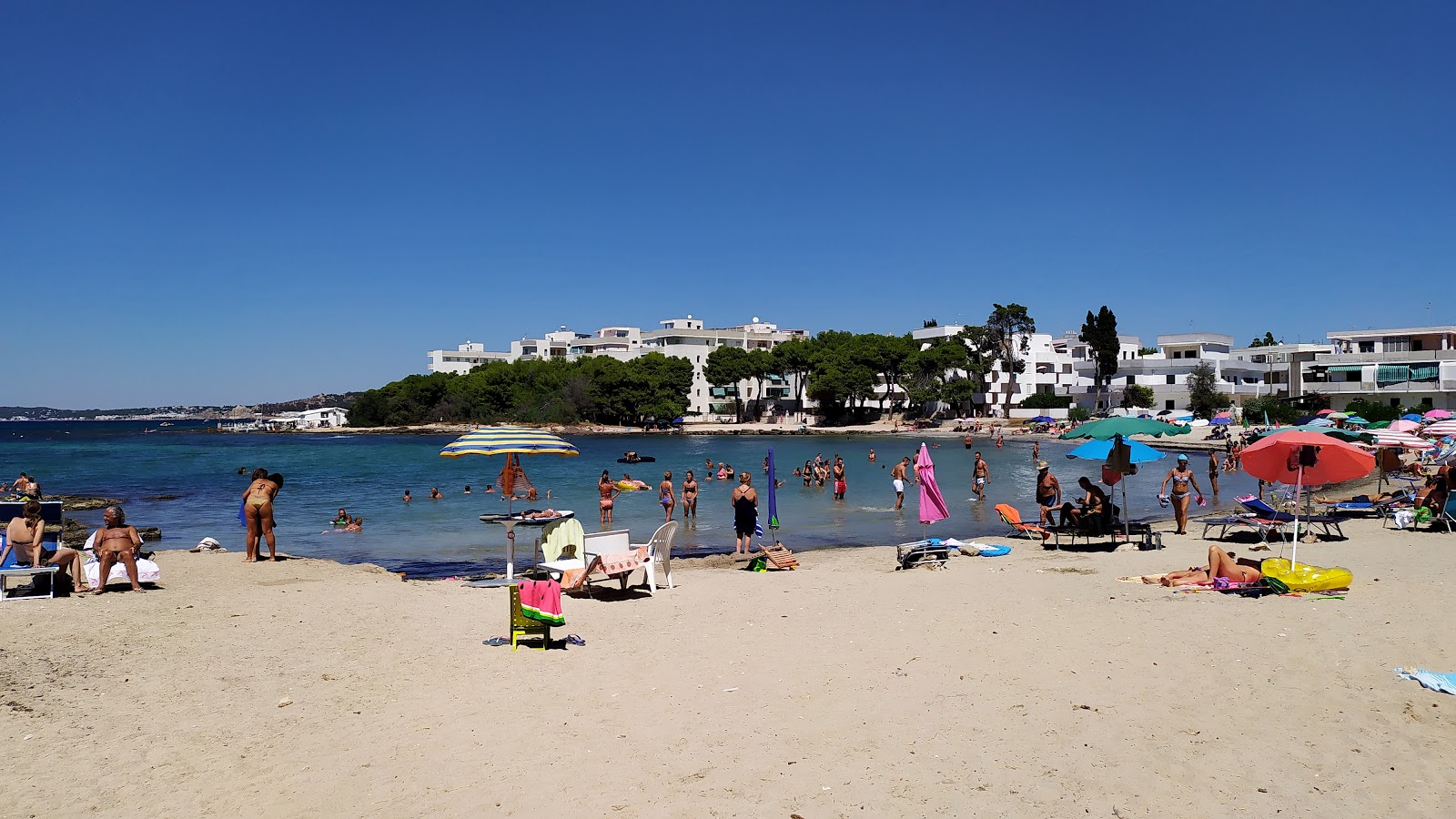 Foto di Spiaggia di Lido Torre con una superficie del sabbia beige
