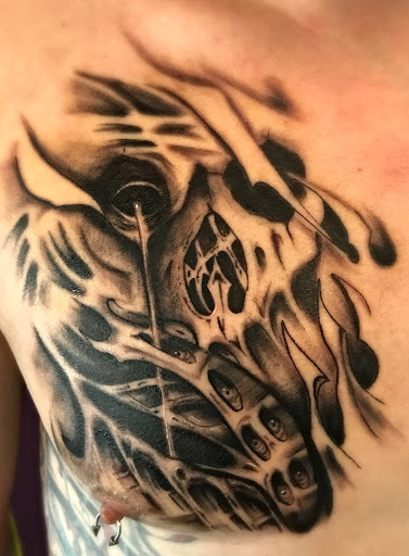 Explore kingfisher tattoo ideas, creative tattoo ideas in Roscoe, available at Elevated Ink Tattoo