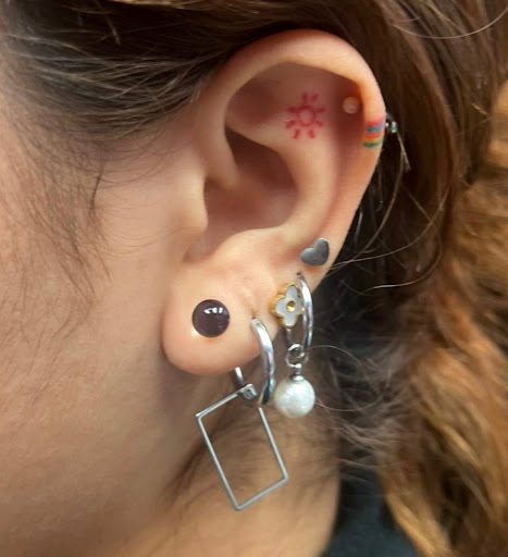 Explore name tattoo ideas for woman, creative tattoo ideas in Miami, available at Asere My Piercing