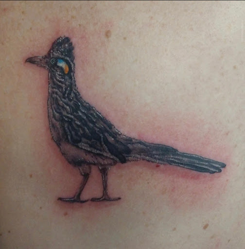 Explore peacock feather tattoo ideas, creative tattoo ideas in Lander, available at Blackblood Tattoo and Piercing