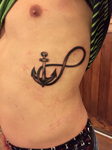 Explore wrap around tattoo ideas, creative tattoo ideas in Rock Island, available at OTool Design Custom Tattoo