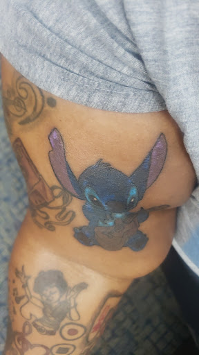 Explore black tattoo ideas for men, creative tattoo ideas in Chicago, available at KnM Body Piercing