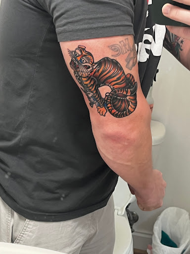 Explore roman numeral tattoo ideas for females, creative tattoo ideas in Chapel Hill, available at Golden Falcon Tattoo and Piercing