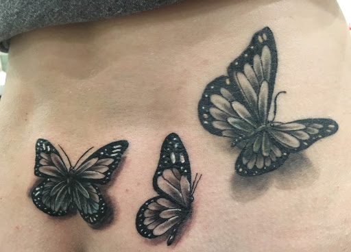Explore cover up tattoo ideas for lower back, creative tattoo ideas in Arlington, available at Urbans Tattoo & Piercing Studio South