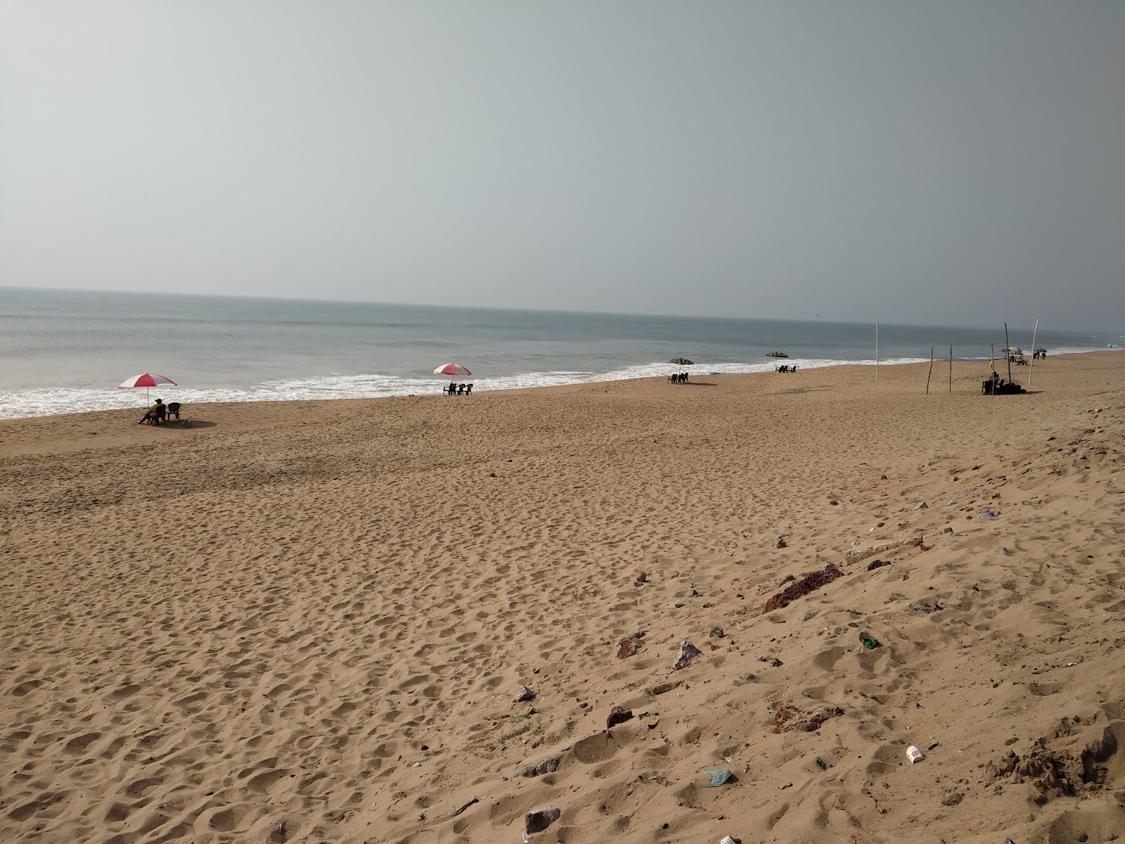 Fotografija Muhana Beach z svetel pesek površino