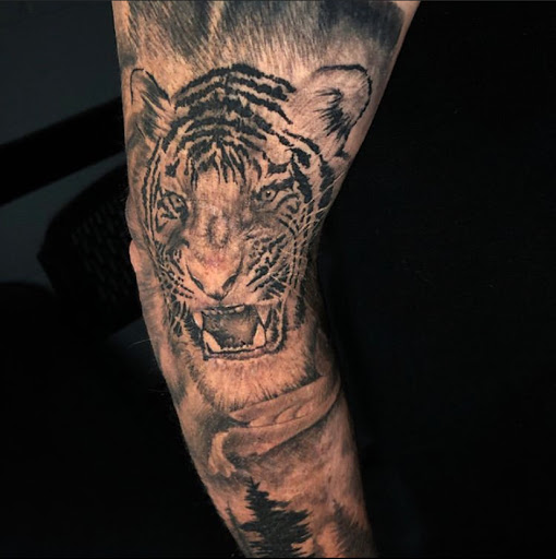 Explore female leg tattoo ideas, creative tattoo ideas in Odessa, available at Black Cat Tattoo Company