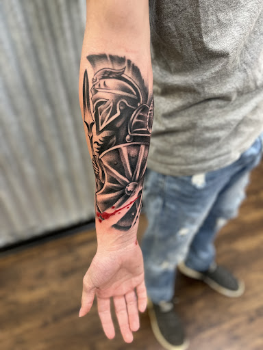 Explore flower spine tattoo ideas, creative tattoo ideas in Leesville, available at Integrity Tattoo