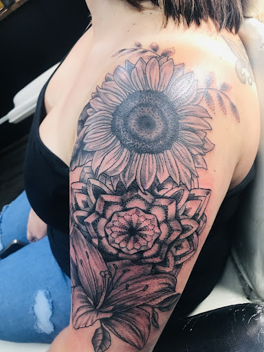 Find tattoo ideas for in between breast for your next unique tattoo in Lake Charles at Brand-X Tattoo & Piercing
