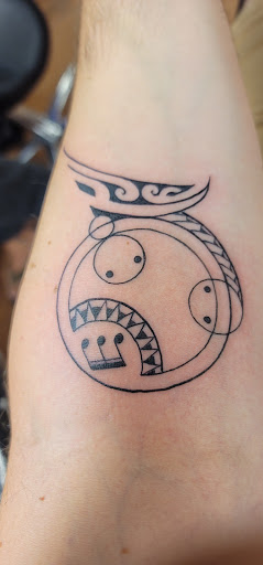 Explore globe tattoo ideas, creative tattoo ideas in Kapolei, available at Sacred Art Tattoo and Coffee Bar - Kapolei