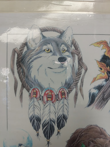 Explore dirt bike tattoo ideas, creative tattoo ideas in Russell, available at Maddog Tattooz