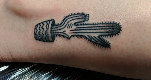 Explore arm blackout tattoo ideas, creative tattoo ideas in Mesa, available at Next Wave Tattoos and Piercings