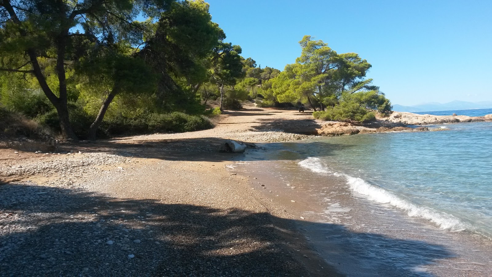 Photo of Ligoneri Beach with green pure water surface