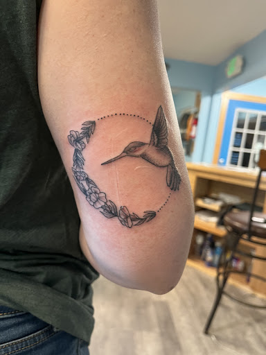 Explore name tattoo ideas on chest, creative tattoo ideas in Powell, available at Hummingbird Tattoo Studio