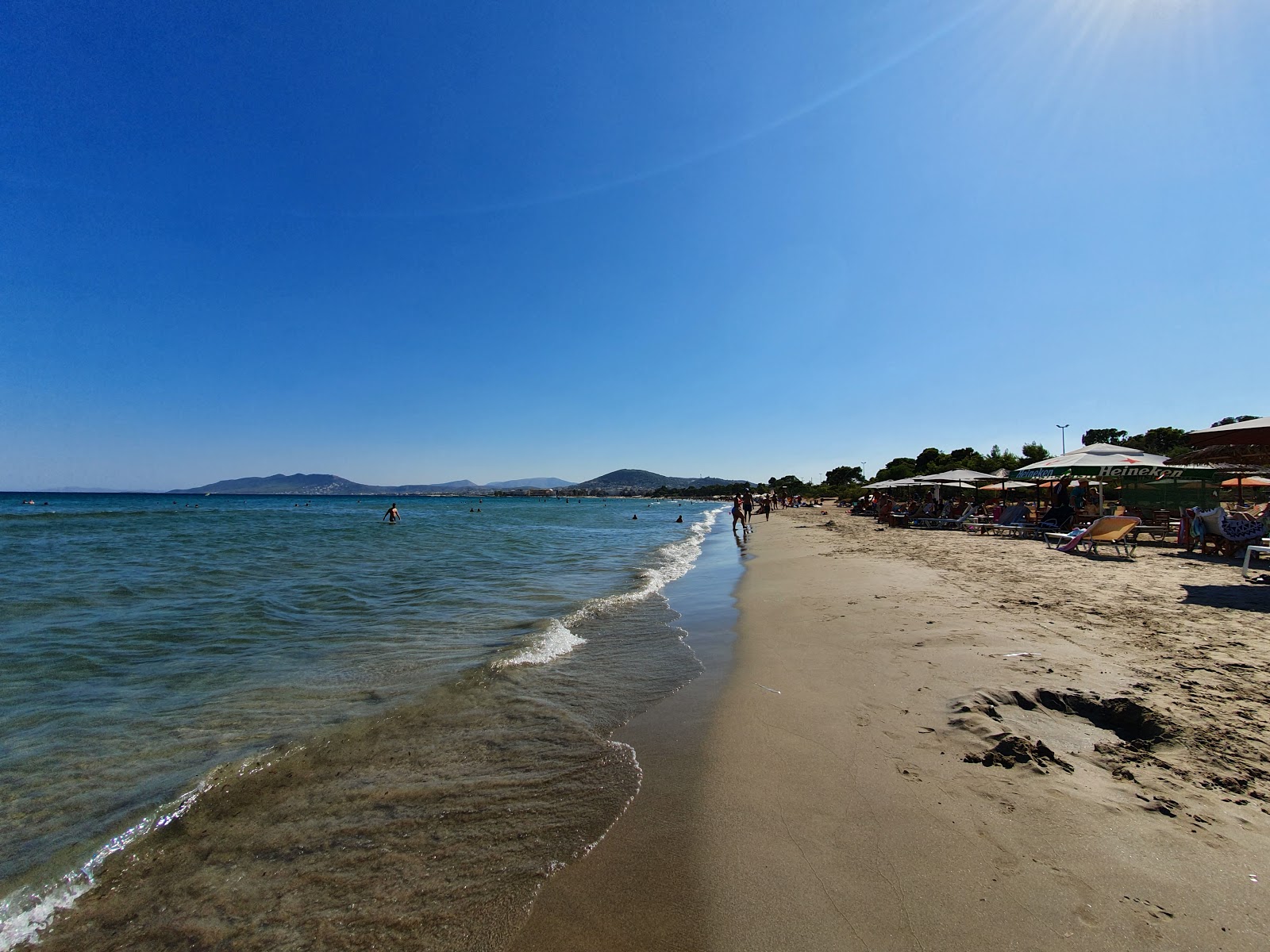 Fotografija Artemis beach z svetel pesek površino