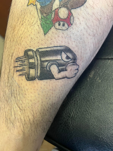 Explore minimalist dog tattoo ideas, creative tattoo ideas in Wisconsin Dells, available at Twisted Dimensions Tattoo Studio