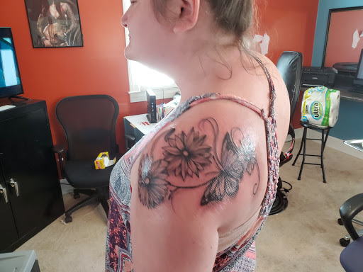 Explore black tattoo ideas for women, creative tattoo ideas in South Boston, available at Eternal Rites Tattoo