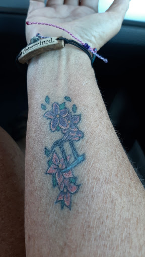 Explore flower garden tattoo ideas, creative tattoo ideas in Conway, available at Primal Urge Tattoos