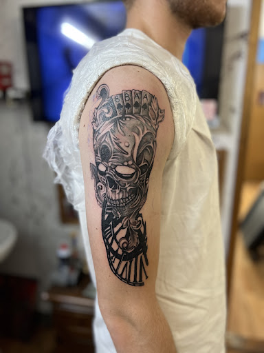 Explore spine tattoo cover up ideas, creative tattoo ideas in Milwaukee, available at West Allis Tattoo & Gallery Tattoo Shop Milwaukee