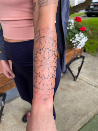 Explore red ink neck tattoo ideas, creative tattoo ideas in Spokane, available at Ron LeMay Tattoo