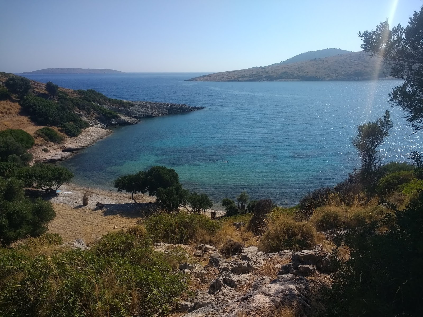 Photo of Ag. Nikolaos beach with light sand &  pebble surface