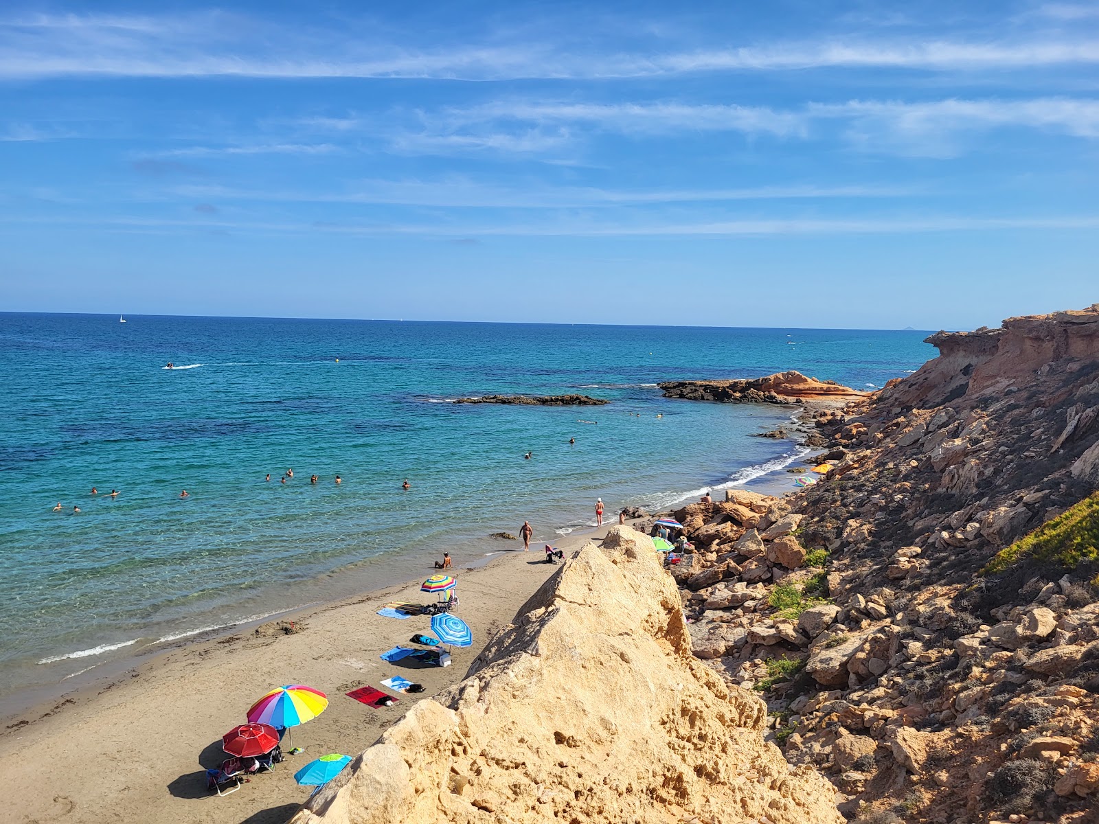 Fotografija Playa Flamenca Naturista z modra čista voda površino