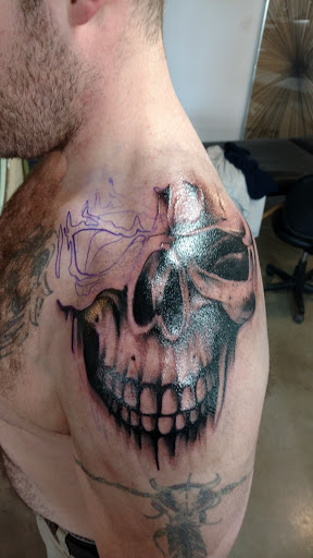 Explore male side tattoo ideas, creative tattoo ideas in Duluth, available at Benchmark Tattoo