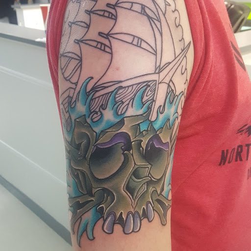 Explore male wedding ring tattoo ideas, creative tattoo ideas in Greenville, available at Lee House Art Studio & Custom Tattoo