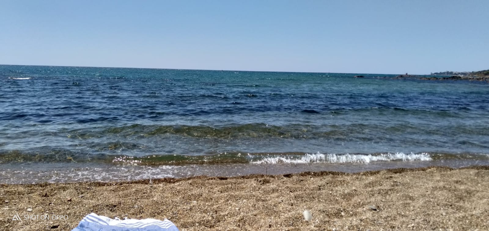 Foto von La spiaggia bella und die siedlung