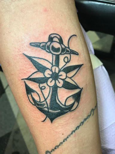 Explore tiny hummingbird tattoo ideas, creative tattoo ideas in Kearney, available at Bread N Butter Tattoo