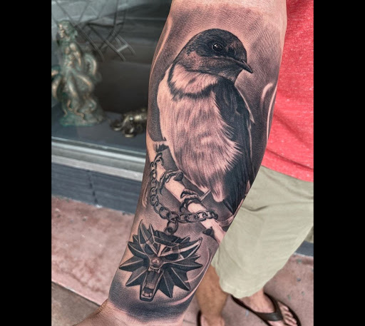 Explore last name tattoo ideas on arm, creative tattoo ideas in Hollywood, available at Sacred Eye Tattoos