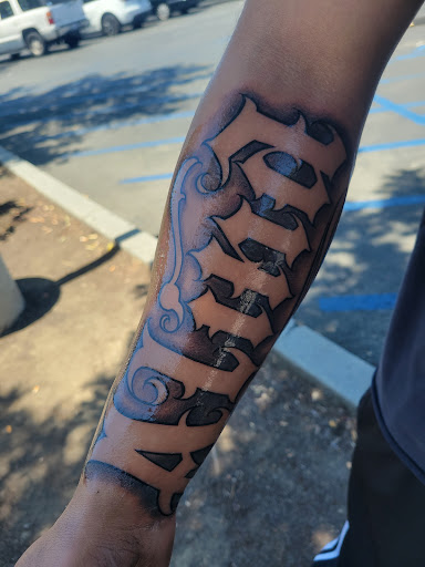 Explore infinity heart tattoo ideas, creative tattoo ideas in Fountain Valley, available at Lowrider Tattoo Studios