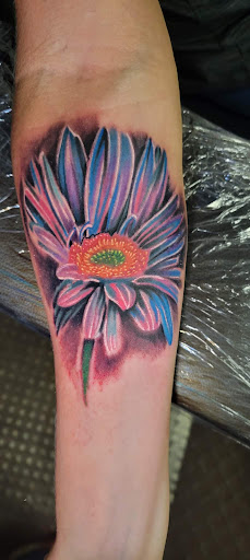 Explore dancing tattoo ideas, creative tattoo ideas in Angola, available at Hoodlum Ink