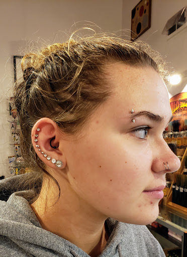 Explore hand tattoos ideas, creative tattoo ideas in Green Bay, available at Colourbox Body Piercing Llc