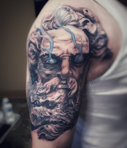 Explore scroll tattoo ideas, creative tattoo ideas in North Bend, available at The Rusty Needle Tattoo Parlor