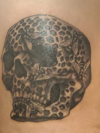 Explore spine tattoo ideas for men, creative tattoo ideas in Ocoee, available at Slaughterized Ink Tattoo and Piercing Studio