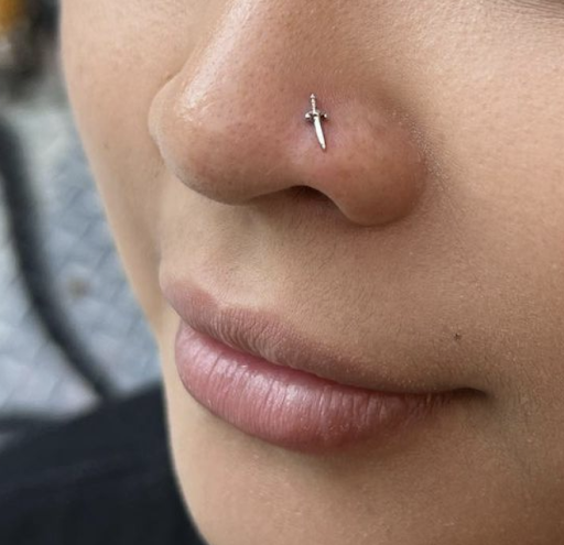 Explore face tattoo ideas for women, creative tattoo ideas in New York, available at Cherry Bomb Tattoo & Piercing Studio - Walk-Ins Welcome