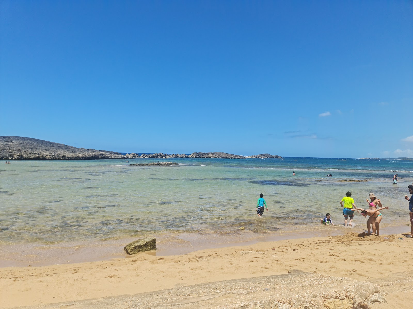 Photo of Playa Puerto Nuevo with turquoise pure water surface