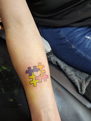 Explore pisces symbol tattoo ideas, creative tattoo ideas in Cocoa, available at Rorschach Tattoo Shop and Piercing Studio