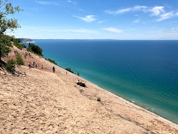 Photo of Sleeping Bear Dunes with turquoise pure water surface