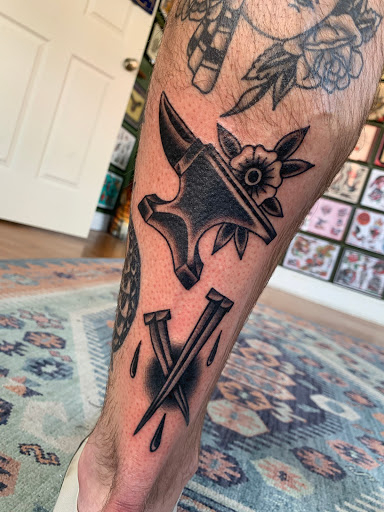 Explore checkered flag tattoo ideas, creative tattoo ideas in Grandville, available at Lighthouse Tattoo Company