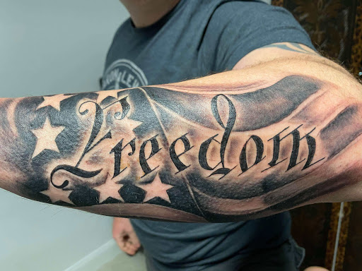 Explore calf tattoo ideas for guys, creative tattoo ideas in Daytona Beach, available at Studio 21 Tattoo & Piercings Daytona Beach