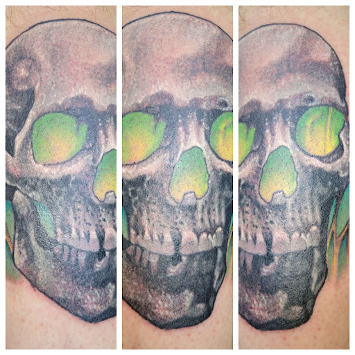 Explore ribbon tattoo ideas, creative tattoo ideas in Angola, available at Hoodlum Ink