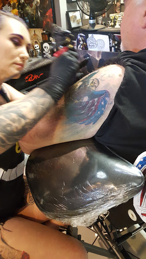 Explore leg tattoo idea for men, creative tattoo ideas in Cincinnati, available at Red Dragon Tattoo & Piercing