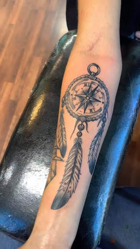 Explore checkered flag tattoo ideas, creative tattoo ideas in Reno, available at Evolution Tattoo